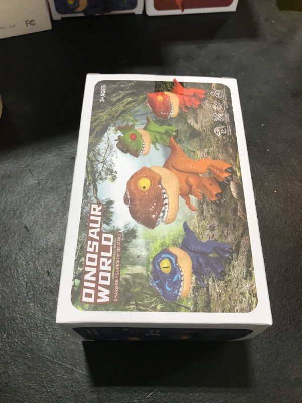 Photo 1 of TSOEPLL 5 in 1 Creative Dinosaur Toy Model Multifunctional Elementary School Stationery Including Ruler, Pencil, Pencil Sharpener, Binding Machine, Back-to-School Gift.