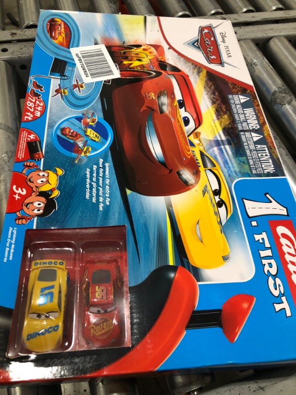 Photo 2 of Carrera First Disney/Pixar Cars - Slot Car Race Track - Includes 2 Cars: Lightning McQueen and Dinoco Cruz - Battery-Powered Beginner Racing Set for Kids Ages 3 Years and Up Disney Cars w/ Spinners