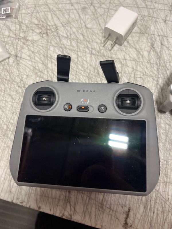 Photo 3 of **DOESN'T CONNECT TO SATELLITE, FOR PARTS ONLY** DJI - Mini 4 Pro Fly More Combo Plus Drone and RC 2 Remote Control with Built-in Screen - Gray - DOESNT CONNECT TO SATELLITE- MISSING POWER CORD - MISSING 1 BATTERY & BATTERY HOLDER ONLY HAS SHOWN IN PICTUR