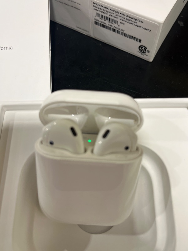 Photo 2 of Apple AirPods (2nd Generation) Wireless Ear Buds, Bluetooth Headphones with Lightning Charging Case Included, Over 24 Hours of Battery Life, Effortless Setup for iPhone
