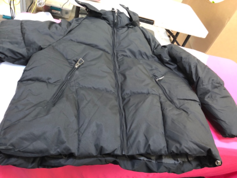 Photo 1 of black puffer jacket 
unknown size 