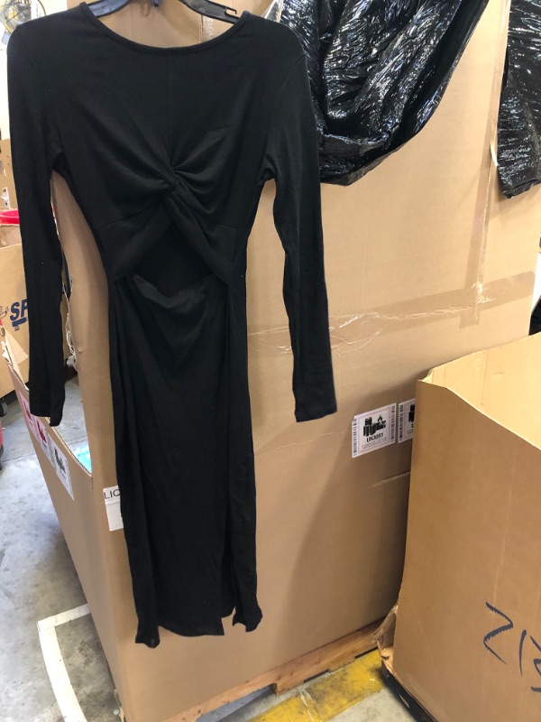 Photo 1 of LONGSLEEVE BLACK DRESS WITH OPEN CUT 
SIZE UNKNOWN 
SIZE APPEARS -SMALL/MEDIUM 