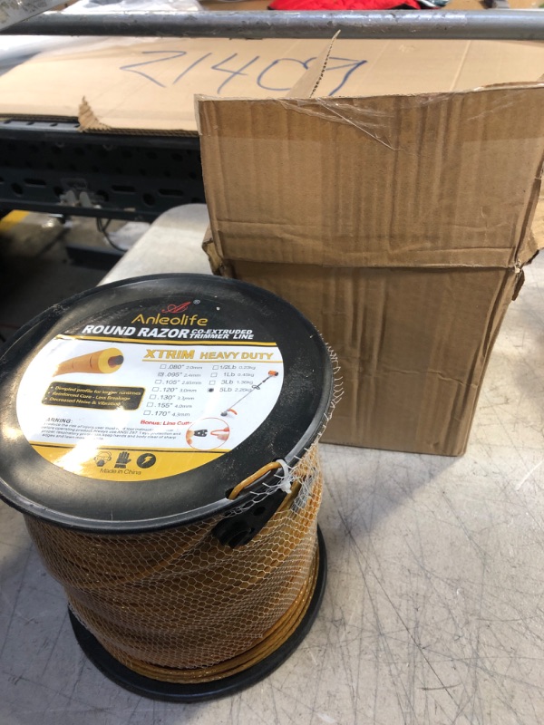 Photo 2 of A ANLEOLIFE 5-Pound Heavy Duty Round .095-Inch-by-1404-ft Trimmer Line Spool,XTRIM Co-Extruded Razor Core Weed Eater String, Gold 5 Pound .095" Gold