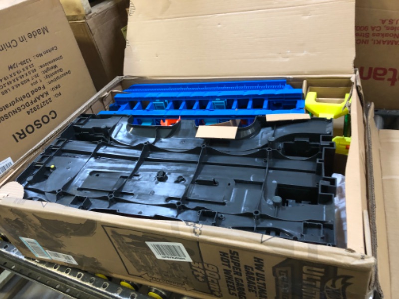 Photo 1 of Hot Wheels City Ultimate Garage Playset with 2 Die-Cast Cars, Toy Storage for 50+ 1:64 Scale Cars, 4 Levels of Track Play, Defeat The Dragon