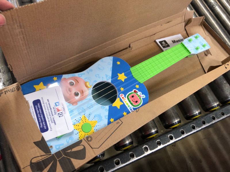 Photo 3 of CoComelon Musical Guitar by First Act, 23.5” Kids Guitar - Plays Clips of The ‘Finger Family’ Song - Musical Instruments for Kids, Toddlers, and Preschoolers