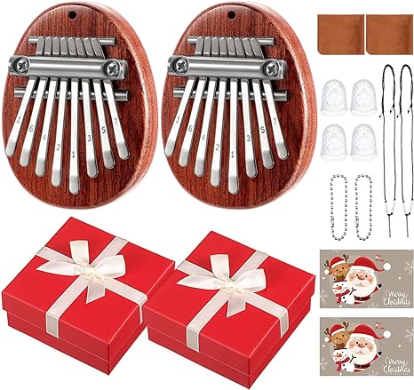 Photo 1 of 2 Set 8 Keys Mini Thumb Piano Include 2 Music Sheet 2 Christmas Card 2 Lanyard Chain 2 Cleaning Cloth 4 Finger Protector with 2 Gift Box for Kids and Adult Beginners Gift(Red)