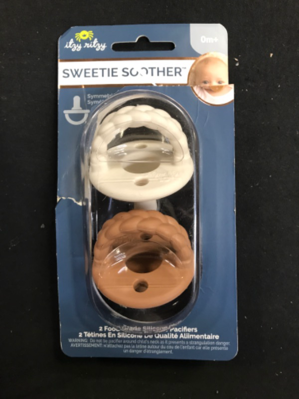 Photo 2 of Itzy Ritzy Sweetie Soother Pacifier Set of 2 - Silicone Newborn Pacifiers with Collapsible Handle & Two Air Holes for Added Safety; Set of 2 in Coconut/Toffee, Ages Newborn & Up Coconut & Toffee 2 Count (Pack of 1)