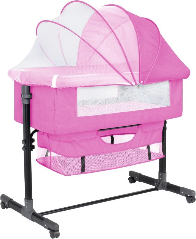 Photo 1 of GoFirst Bedside Bassinet for Baby, Bedside Sleeper with Wheels, Heigt Adjustable, with Mosquito Nets, Large Storage Bag, for Infant/Baby/Newborn (Pink)
