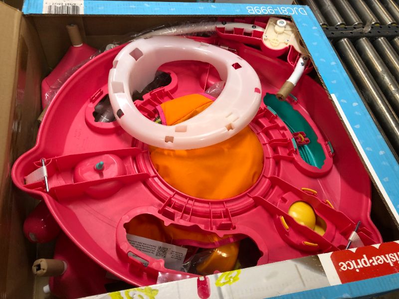 Photo 1 of Fisher-Price Jumperoo Baby Bouncer and Activity Center with Spinning Seat plus Lights Music Sounds and Baby Toys, Pink Petals