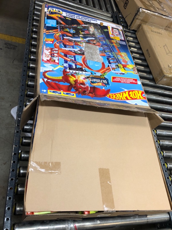 Photo 1 of Hot Wheels City Ultimate Garage Playset with 2 Die-Cast Cars, Toy Storage for 50+ 1:64 Scale Cars, 4 Levels of Track Play, Defeat The Dragon