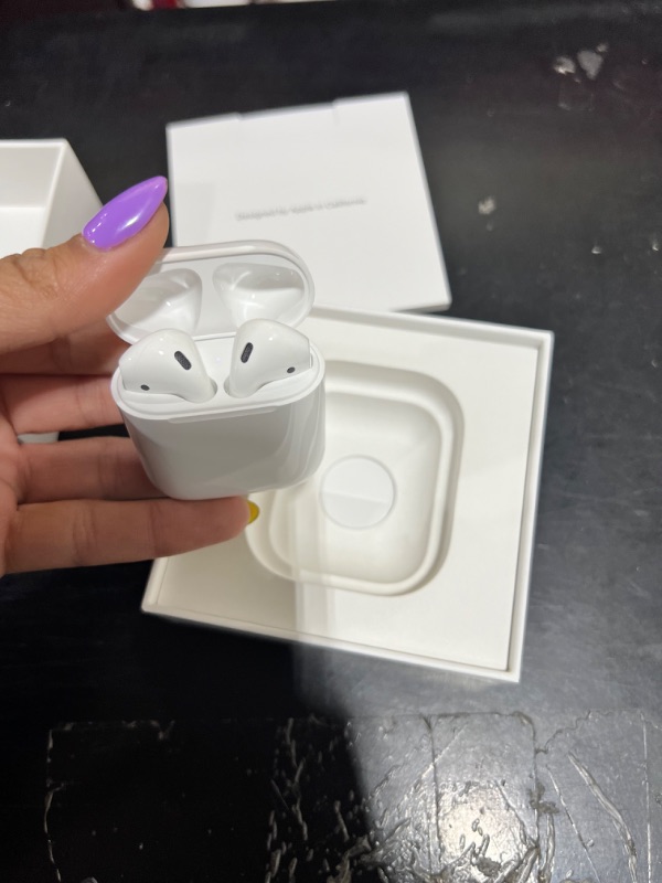 Photo 3 of Apple AirPods with Charging Case (Latest Model)