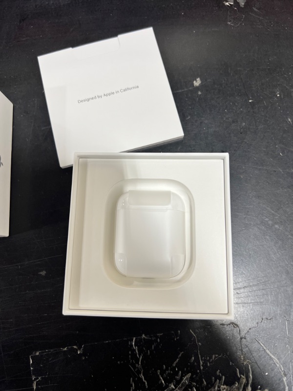 Photo 4 of Apple AirPods with Charging Case (Latest Model)