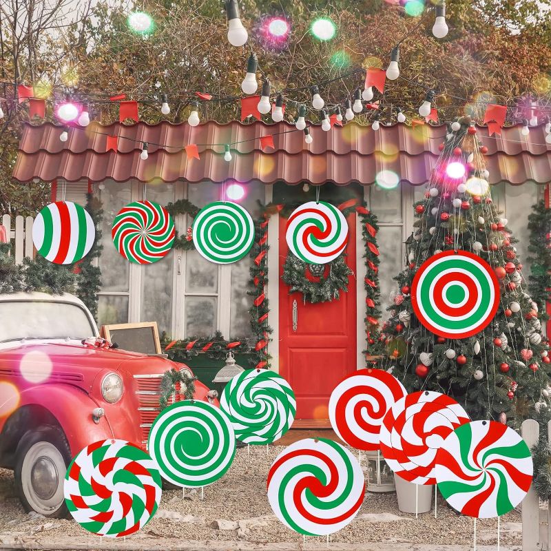 Photo 1 of 15 Pcs Christmas Candy Yard Signs Candy Land Lawn Hanging Ornaments Peppermint Corrugated Yard Decorations with 15 Plastic Stakes String for Christmas Outdoor Porch Pathway Decor