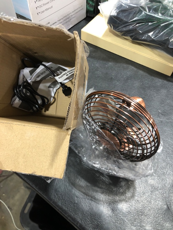 Photo 1 of HOLMES 4" Mini Heritage Desk Fan, USB-Powered, Single Speed, 4 Blades, Adjustable 100° Head Tilt, Metal Construction, Ideal for Home, Dorm Rooms, Bedrooms, Office or Travel, Vintage Brushed Copper Brushed Copper 4-inch