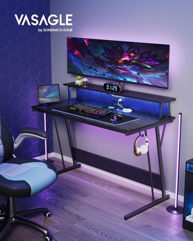 Photo 1 of *****MISSING PIECES//SOLD AS PARTS***** 
VASAGLE by SONGMICS HOME LED Gaming Desk with Power Outlets, Computer Desk with USB Ports, Office Desk with Monitor Stand for 2 Monitors, with Hooks, for Bedroom, 23.6 x 47.2 x 29.5 Inches Ebony Grey
