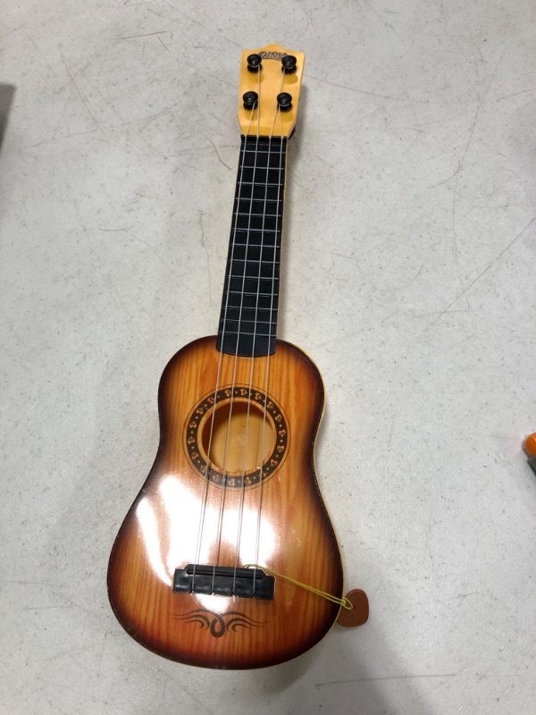 Photo 2 of 17" Kids Guitar Toy Ukulele, Plastic Musical Instrument Toy with 4 Nylon Strings for Toddler, Kids Educational Christmas Toys Gifts for 3 4 5 Year Old Boys Girls 17" Wood