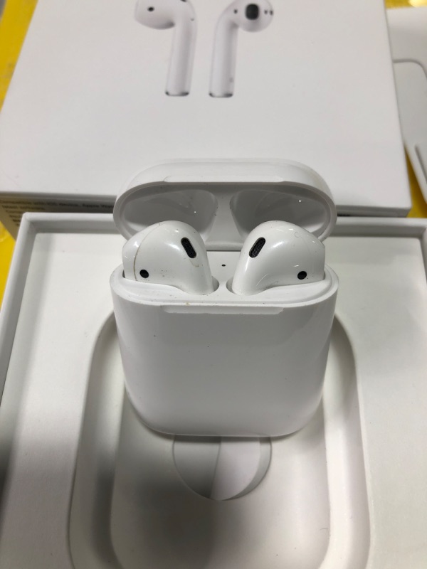 Photo 2 of Apple AirPods with Charging Case (Latest Model)