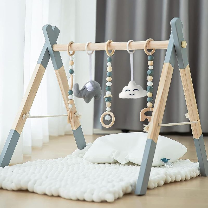 Photo 1 of Avrsol Wooden Baby Play Gym Foldable Baby Play Gym Frame Activity Gym Hanging Bar with 5 Gym Baby Toys Natural Gift for Newborn Baby (Foldable Grey)
