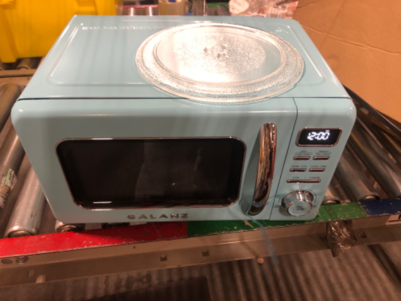 Photo 5 of ** new open package**
Galanz GLCMKZ07BER07 Retro Countertop Microwave Oven with Auto Cook & Reheat, Defrost, Quick Start Functions, Easy Clean with Glass Turntable, Pull Handle.7 cu ft, Blue Blue .7 cu ft Modern