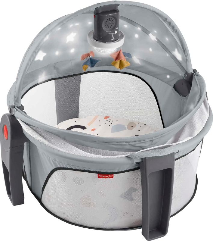 Photo 1 of Fisher-Price Portable Baby Bassinet and Play Space Deluxe On-the-Go Projection Dome with Lights Music and Canopy, Paper Shapes
