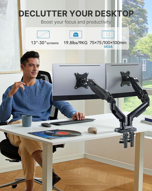 Photo 1 of HUANUO Dual Monitor Stand - Adjustable Spring Monitor Desk Mount Swivel Vesa Bracket with C Clamp,