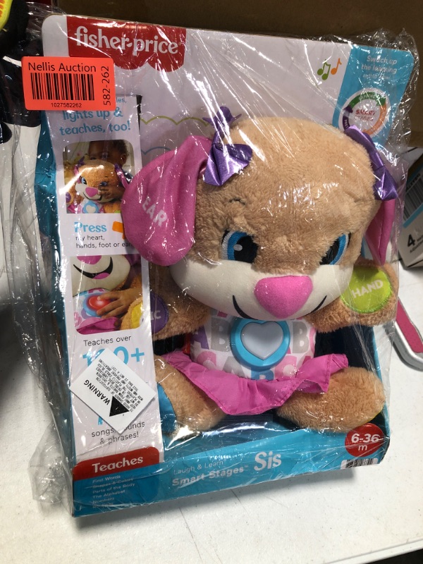 Photo 2 of Fisher-Price Laugh & Learn Baby & Toddler Toy Smart Stages Sis Plush Dog with Music Lights & Learning Content for Ages 6+ Months? 1 count Sis - Pink