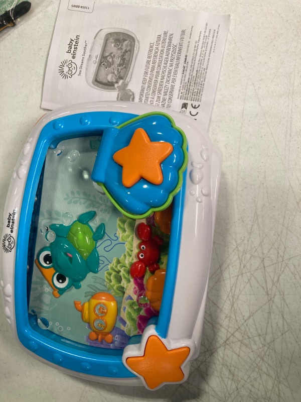 Photo 1 of Baby Einstein Sea Dreams Soother Musical Crib Toy and Sound Machine, Newborns Plus