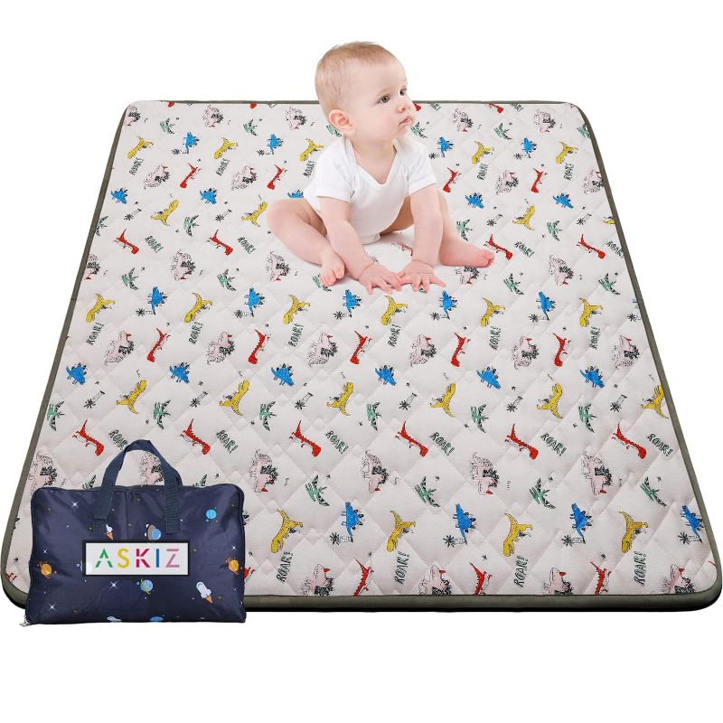 Photo 1 of Baby Play Mat for Floor 50x50 Inches, Thick Foldable Crawling Mat with Packing Bag,Padded No Toxic Polyester Fiber Cute Cartoon Dinosaur Pattern Playmats for Girl Boy and 0-6 Month Baby
