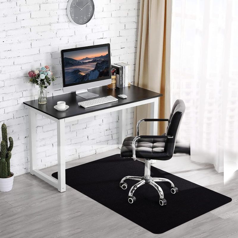 Photo 1 of **USED** Office Chair Mat for Hardwood & Tile Floor, 55"x35" Computer Gaming Rolling Chair Mat, Under Desk Low-Pile Rug, Large Anti-Slip Floor Protector for Home Ofiice (Black)
