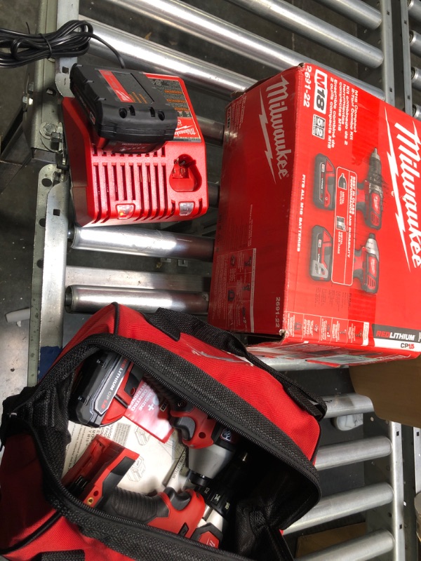 Photo 2 of ***CHARGER NON FUNCTIONAL***   Milwaukee 2691-22 18-Volt Compact Drill and Impact Driver Combo Kit