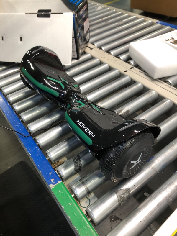 Photo 1 of Hover-1 Superfly Electric Hoverboard, 7MPH Top Speed, 6 Mile Range, Long Lasting Li-Ion Battery, 5HR Full Charge, Built-In Bluetooth Speaker, Rider Modes: Beginner to Expert, Black
***Charger is functional, but could not power on due to no charge*** 