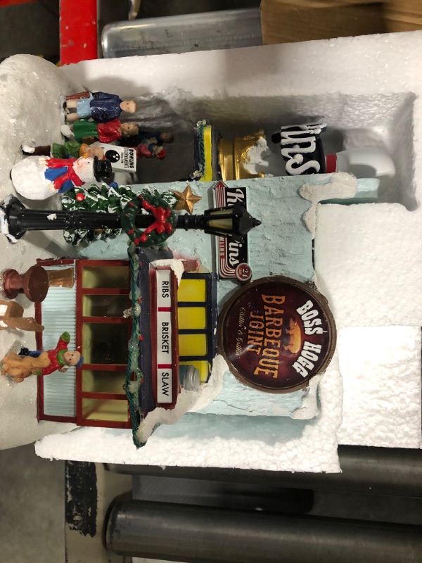 Photo 2 of Moments in Time Christmas Village Building, King Pins Bowling Alley and Boss Hogg Barbeque Joint with LED Lights and Christmas Music - Battery Operated (not Included) (8.4" H x 9.25" W x 8.6" D)