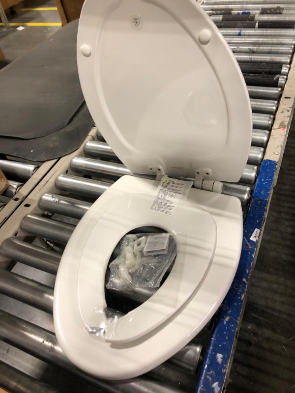 Photo 3 of **SOLD FOR PARTS**
MAYFAIR 1888SLOW 000 NextStep2 Toilet Seat with Built-In Potty Training Seat, Slow-Close, Removable that will Never Loosen, ELONGATED, White Elongated White
**BABY SEAT CRACKED IN MIDDLE**
**MISSING ONE CAP FOR ATTACHMENT