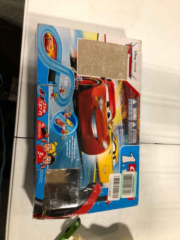 Photo 2 of Carrera First Disney/Pixar Cars - Slot Car Race Track - Includes 2 Cars: Lightning McQueen and Dinoco Cruz - Battery-Powered Beginner Racing Set for Kids Ages 3 Years and Up Disney Cars w/ Spinners