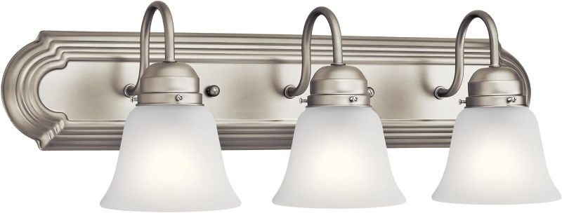 Photo 1 of *** product is not exactly the same as the display picture but is close in style ****

Kichler 24" 3-Light Vanity Bath Light in Brushed Nickel, Modern Bathroom Light with Clear Satin Etched Glass, (24" W x 8" H), 5337NIS
