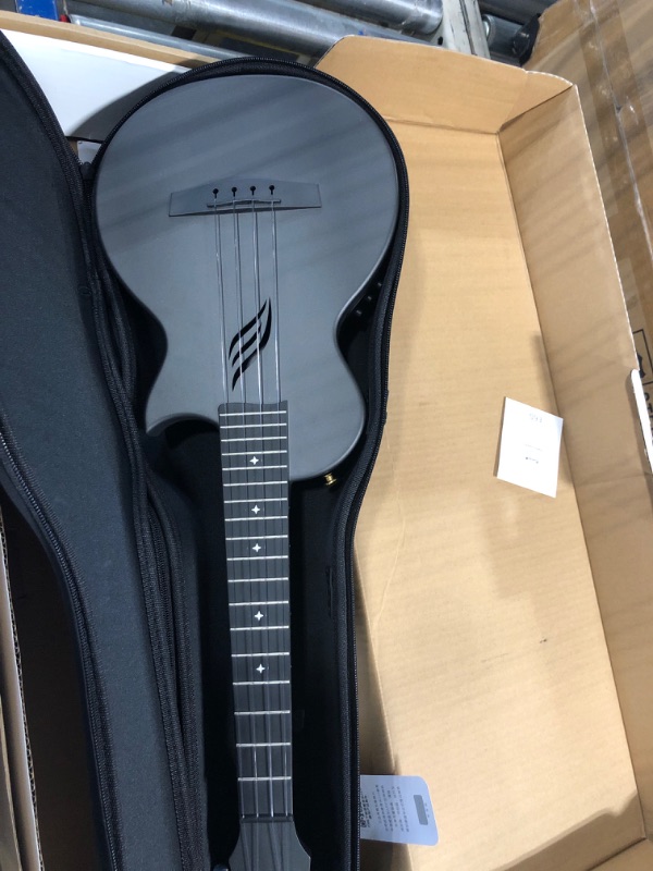 Photo 1 of Enya Concert Ukulele Nova U 23’’ Carbon Fiber Travel Ukulele with Beginner Kit includes online lessons, case, strap, capo and strings (Black)