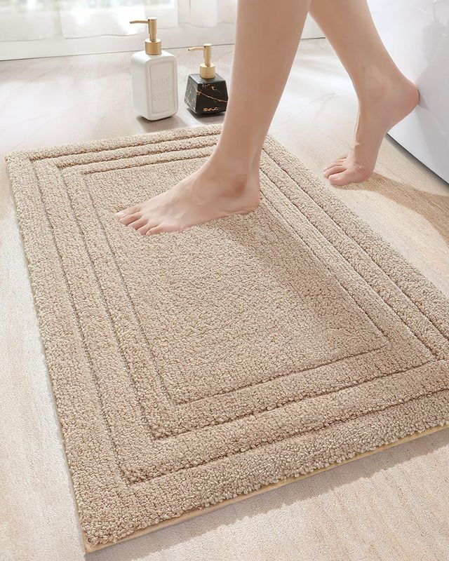 Photo 1 of DEXI Bathroom Rug Mat, Ultra Soft Absorbent Bath Mats for Bathroom, Shower Floor Bathmat Non Slip, Washable Bath Rugs Carpet for Tub, Sink, 16"x23.5", Beige -- SMALL