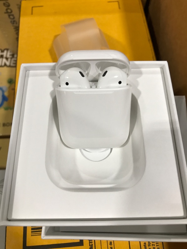 Photo 2 of Apple AirPods (2nd Generation) Wireless Ear Buds, Bluetooth Headphones with Lightning Charging Case Included, Over 24 Hours of Battery Life, Effortless Setup for iPhone Without AppleCare+