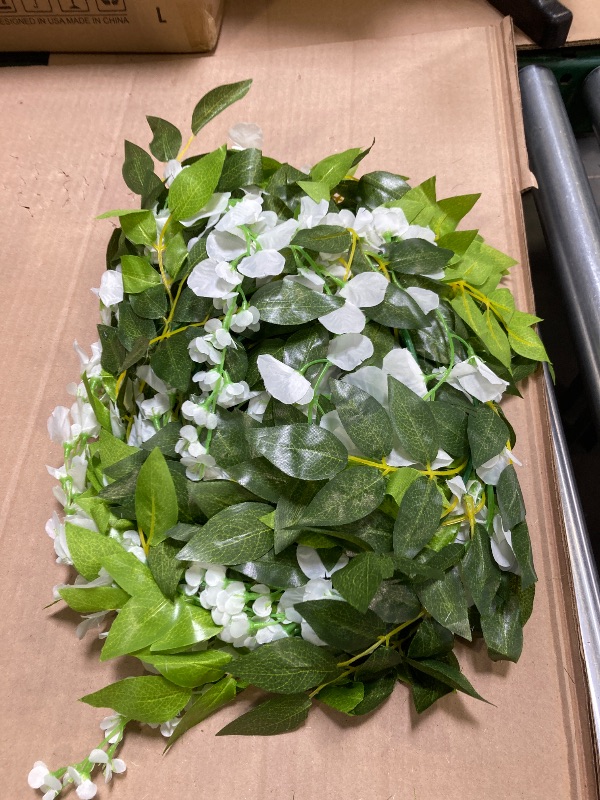 Photo 1 of Lvydec Wisteria Artificial Flowers Garland, 4Pcs Total 28.8ft White Artificial Wisteria Vine Silk Hanging Flower for Home Garden Outdoor Ceremony Wedding Arch Floral Decor