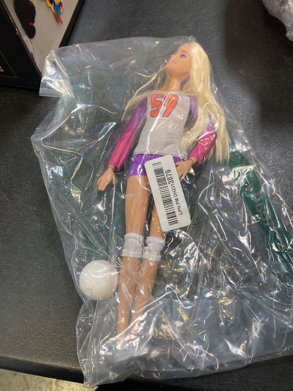 Photo 1 of Barbie Careers Fashion Doll & Accessory, Made to Move Volleyball Player Wearing Removable Uniform with Ball, 22 Bendable Joints