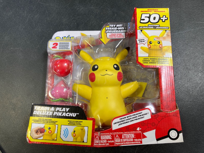 Photo 1 of Pokémon Train and Play Deluxe Pikachu - 4.5-Inch Pikachu Figure with Lights, Sounds, and Moving Limbs Plus Interactive Accessories