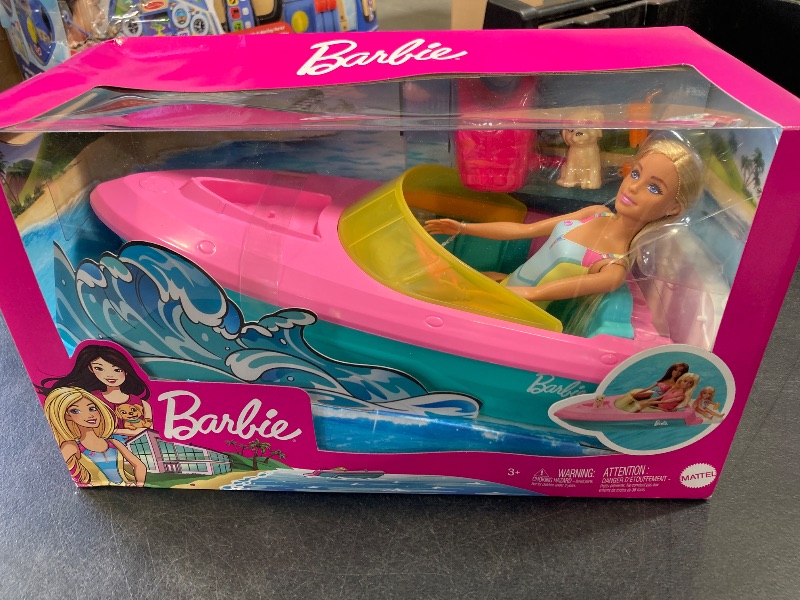 Photo 1 of Barbie Doll & Toy Boat Playset with Pet Puppy, Life Vest & Beverage Accessories, Fits 3 Dolls & Floats in Water