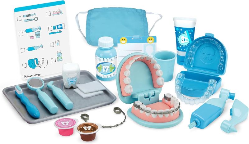 Photo 1 of  Melissa & Doug Super Smile Dentist Kit With Pretend Play Set of Teeth And Dental Accessories (25 Toy Pieces) Pretend Dentist Play Set, For Kids Ages 3+ 