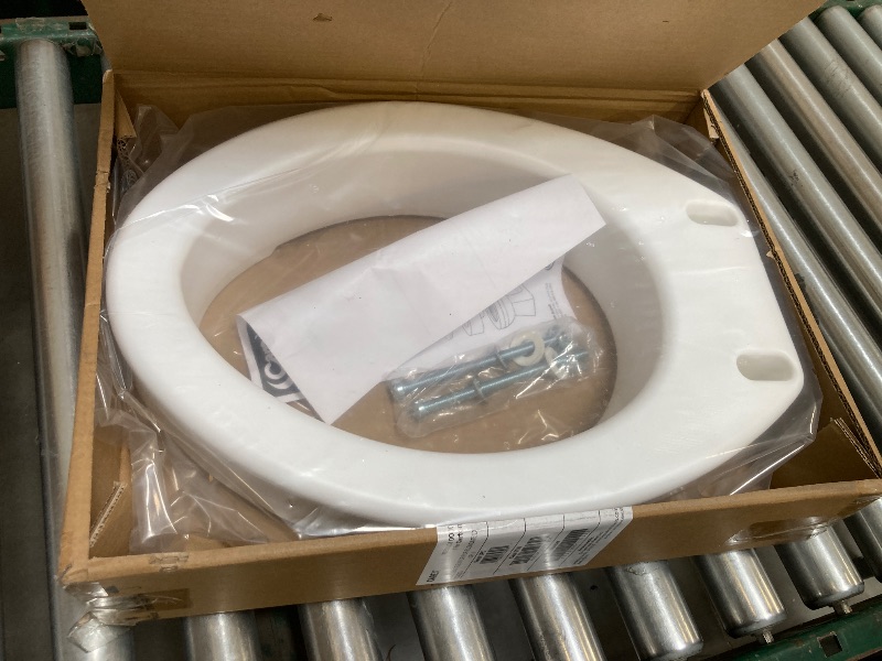 Photo 1 of Carex Toilet Seat Riser, Elongated Raised Toilet Seat Adds 3.5 inches to Toilet Height, for Assistance Bending or Sitting, 300 Pound Weight Capacity Toilet Riser