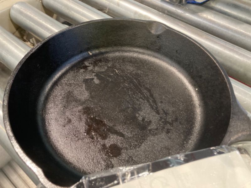 Photo 2 of ****Grease residue from Pre seasoning**Lodge 9 Inch Cast Iron Pre-Seasoned Skillet – Signature Teardrop Handle - Use in the Oven, on the Stove, on the Grill, or Over a Campfire, Black