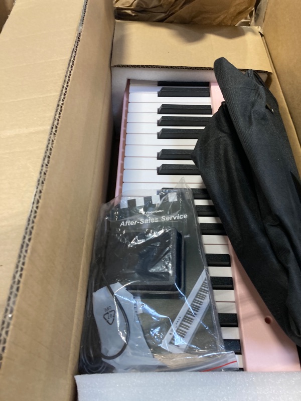 Photo 3 of ***USED Missing music stand / Headphones***
Portable Piano Keyboard, Semi-Weighted Folding Digital Piano 88 Key, Full Size, Wood Grain, Electric Piano Keyboard w/MIDI Bluetooth, Suitable for Adult, Toddler, Kids 88 Key Pink