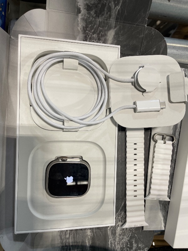 Photo 2 of Apple Watch Ultra 2 [GPS + Cellular 49mm] Smartwatch with Rugged Titanium Case and White Ocean Band. Fitness Tracker