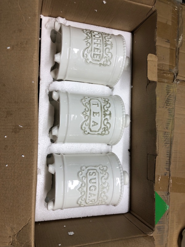 Photo 1 of ***Slightly Cracked***
25 Ounce Elegant Ceramic Kitchen Canisters Set of 3 - Engraved Coffee Tea Sugar Storage Containers with Feet for Added Style and Stability - Ceramic Jar with Airtight Lid