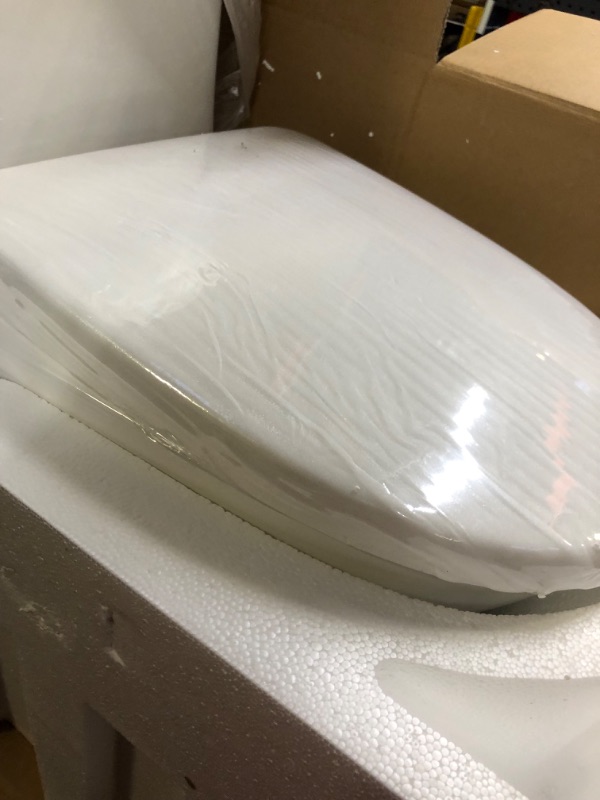 Photo 1 of Swiss Madison SM-1T257 Sublime II Compact 24" Length One Piece Toilet Dual Flush 1.1/1.6 GPF with Side Holes, Glossy White Dual Flush Compact Glossy White