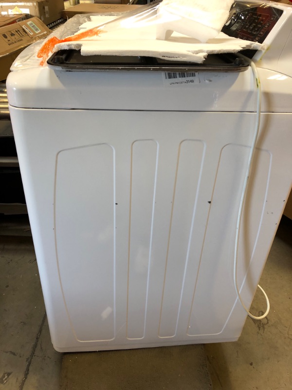 Photo 1 of Frigidaire FFTW4120SW 4.1 cu. ft. High Efficiency Top Load Washer, 12 wash cycles, Quick Wash, Delicate, Hand Wash, Active Wear, Heavy Duty, Stainless Steel Drum, in White
TURNS ON BUT UNABLE TO TEST 
DENTED ON SIDE 